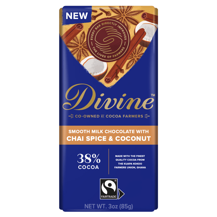 Divine Co-Owned Cocoa Farmers smooth milk chocolate bar with chai spice and coconut flavor, featuring a dark blue wrapper with gold and orange accents, 38% cocoa, and a Fairtrade logo.