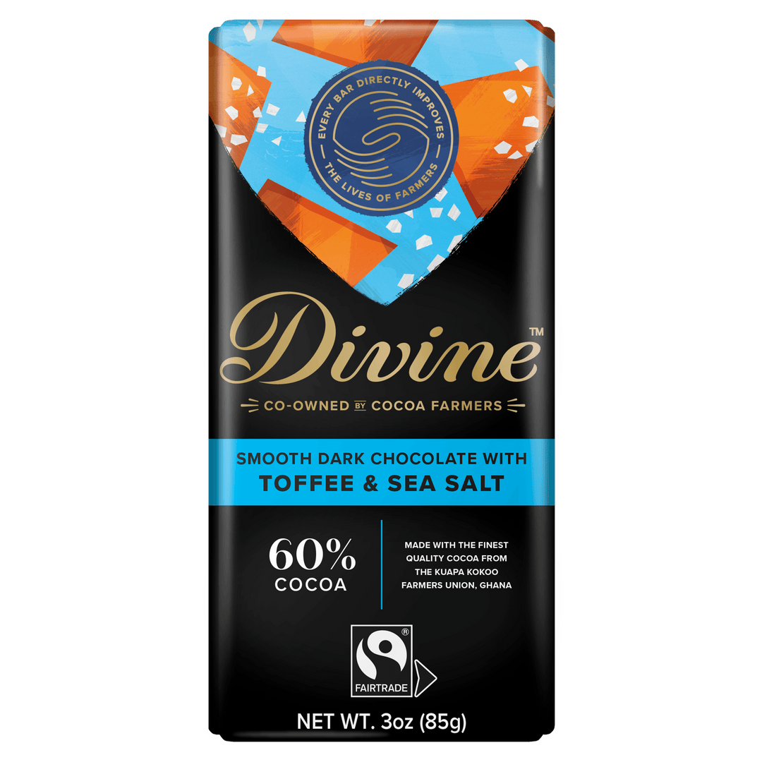 A 3 oz bar of Divine Fair Trade Direct Fairness Chocolate with Toffee & Sea Salt, featuring a black wrapper with gold, blue, and orange accents, and a Fairtrade logo.