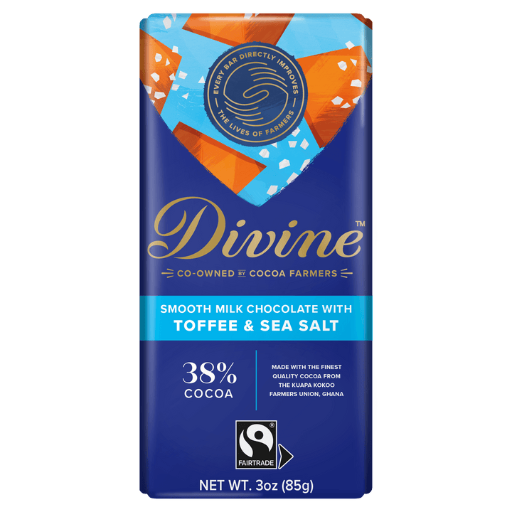 A 3 oz bar of Divine Smooth Milk Chocolate with Toffee & Sea Salt, featuring a dark blue wrapper with gold and light blue text and graphics, and a Fairtrade logo at the bottom.