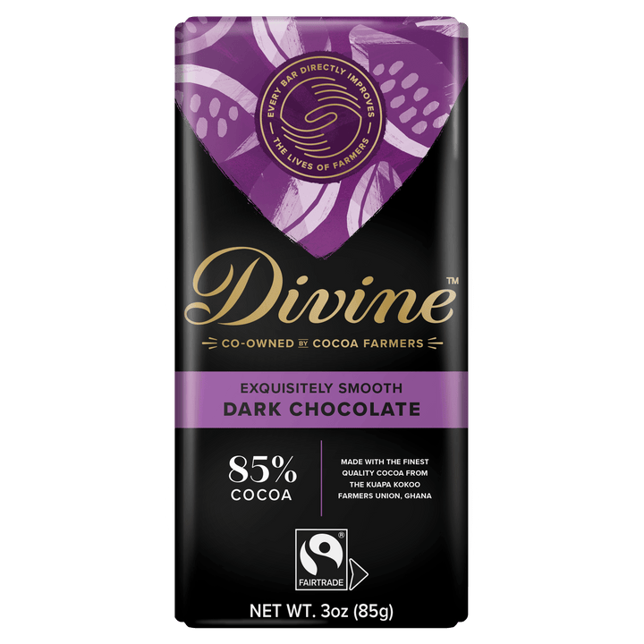 Divine 85% cocoa dark chocolate bar in black and purple packaging, co-owned by cocoa farmers and Fairtrade certified.