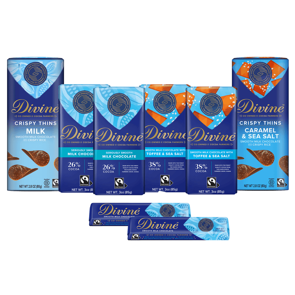 A set of Divine brand chocolate bars and boxes arranged on a plain white background. The packaging is predominantly blue with white and orange accents, and the visible product names include Crispy Thins Milk, Semisweet Chocolate Milk Chocolate, Toffee & Sea Salt, and Crispy Thins Caramel & Sea Salt.