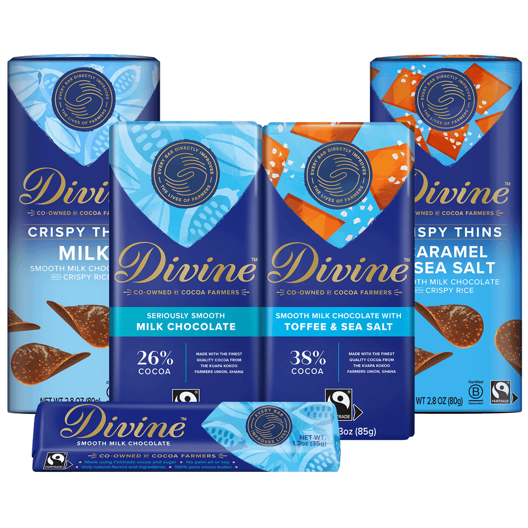 A group of Divine chocolate bars in blue packaging, including Milk Chocolate, Smooth Milk Chocolate with Toffee & Sea Salt, and Caramel Sea Salt with Crispy Rice, arranged together on a white background.