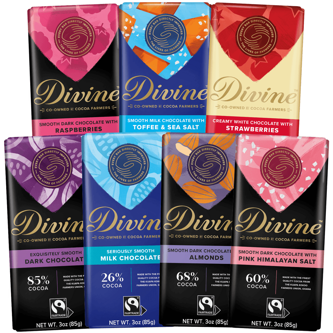 Six Divine brand cocoa farmer chocolate bars arranged in two rows on a black background. The top row shows four bars with colorful heart-shaped flavor graphics (Raspberries, Toffee & Sea Salt, White Chocolate with Strawberries), and the bottom row shows two dark chocolate bars with purple and pink heart graphics (Exclusively Smooth Dark Chocolate, Seriously Smooth Milk Chocolate with 26% cocoa, Smooth Dark Chocolate with 68% cocoa, and Smooth Dark Chocolate with 60% cocoa and Pink Himalayan Salt).